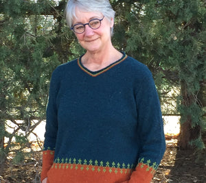 Ann Budd models Ardis, a top down set in sleeve pullover designed during class!