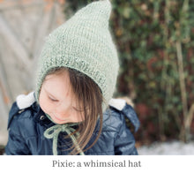 Load image into Gallery viewer, A photo of a child wearing an adorable hat with a pointed top. The hat is called Pixie and is from the book, Newfoundland Knits for Little Ones by Katie Noseworthy.
