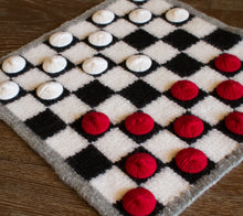 Load image into Gallery viewer, A felted checkerboard with wool pieces, ready for play.