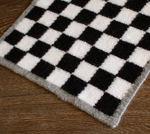 Load image into Gallery viewer, A felted checkerboard says &quot;cabin time&quot; like no other.