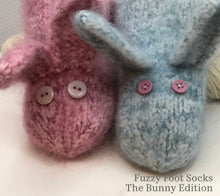 Load image into Gallery viewer, A photo of two felted slippers, one pink and one blue, that look like adorable bunnies.