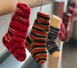 Mini stockings hanging by the fire with care, in hopes that St. Nicholas would fill them with a candy!