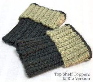 A photo of a set of Top Shelf (Boot) Toppers made in RCY El Rio. The upper cuff is worked in light green, "Soft Sage". The under cuff is worked in dark green, "Juniper".
