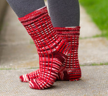 Load image into Gallery viewer, An image of the Gridiron Socks, showing the lovely vertical lines that can be achieved when using RCY Touchdown yarn.
